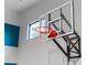 Close-up of an indoor basketball hoop, set against a modern interior design with natural light at 1297 Grand Traverse Pkwy, Reunion, FL 34747