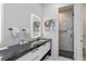 Contemporary bathroom with a sleek vanity, LED mirror, and a glass-enclosed shower at 1297 Grand Traverse Pkwy, Reunion, FL 34747