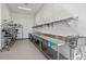 Spacious commercial kitchen with stainless steel countertops and ample shelving at 1297 Grand Traverse Pkwy, Reunion, FL 34747