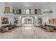 Spacious foyer with marble flooring, statement artwork, and open balcony overlooking the entrance at 1297 Grand Traverse Pkwy, Reunion, FL 34747