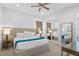 Elegant main bedroom featuring modern decor, and a sliding closet door at 1297 Grand Traverse Pkwy, Reunion, FL 34747