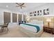 Inviting main bedroom featuring a ceiling fan, recessed lighting, and stylish window coverings at 1297 Grand Traverse Pkwy, Reunion, FL 34747