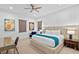 Well-lit main bedroom showcasing neutral tones, modern decor, and a cozy ambiance at 1297 Grand Traverse Pkwy, Reunion, FL 34747