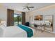 Stylish main bedroom featuring pool views, a modern desk, and contemporary decor at 1297 Grand Traverse Pkwy, Reunion, FL 34747