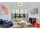 Bright playroom with modern furniture, a large window view, and a playful geometric rug at 1297 Grand Traverse Pkwy, Reunion, FL 34747