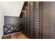 Custom wine cellar with wooden shelves, racks, and floors, designed for organized and stylish wine storage and display at 1297 Grand Traverse Pkwy, Reunion, FL 34747