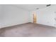 Neutral bedroom with carpet flooring, white walls, and walk-in closet at 1344 Blue Stem Lane, Winter Park, FL 32792