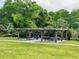 Shaded picnic area with tables and benches, ideal for outdoor dining and gatherings in a green space at 1344 Blue Stem Lane, Winter Park, FL 32792