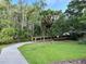 Scenic walking trail surrounded by lush greenery, inviting residents to enjoy nature and exercise at 1344 Blue Stem Lane, Winter Park, FL 32792