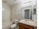 Cozy bathroom featuring shower and tub combo, and a vanity with a wooden cabinet at 13441 Starry Night Ct # 9, Orlando, FL 32824