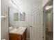 Cozy bathroom featuring a vanity with a wooden cabinet and an interior door at 13441 Starry Night Ct # 9, Orlando, FL 32824