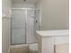 Bathroom featuring a glass-enclosed shower and a toilet at 13441 Starry Night Ct # 9, Orlando, FL 32824