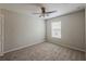 Neutral bedroom features carpet flooring, a window, and a ceiling fan with a light at 13441 Starry Night Ct # 9, Orlando, FL 32824