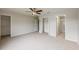 Expansive carpeted bedroom with open doors to the bathroom and closet at 13441 Starry Night Ct # 9, Orlando, FL 32824