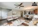 A staged view of a living room featuring stylish furniture, a ceiling fan, and an open layout at 13441 Starry Night Ct # 9, Orlando, FL 32824