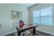 Comfortable home office with hardwood floors, a modern chair, and a window for natural light at 14031 Jomatt Loop, Winter Garden, FL 34787