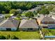 An aerial view showcasing the neighborhood, complete with lush greenery, well-maintained homes, and proximity to nature at 150 Magnolia Park Trl, Sanford, FL 32773