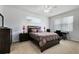 Comfortable bedroom with neutral carpet, white walls, and ample natural light at 150 Magnolia Park Trl, Sanford, FL 32773