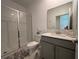 Bathroom featuring glass shower, a vanity with quartz countertops, and tiled floor at 2006 Myrtle Pine St, Kissimmee, FL 34746