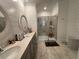 Modern bathroom featuring double sinks, a glass-enclosed shower, and contemporary finishes for a spa-like experience at 2006 Myrtle Pine St, Kissimmee, FL 34746