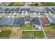 Aerial view of the backyard featuring a white fence and green grass at 207 Polermo Ave, St Cloud, FL 34771