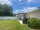 Spacious backyard with a patio area, perfect for outdoor entertaining at 2413 Sandridge Cir, Eustis, FL 32726