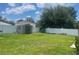 Large backyard with a storage shed and plenty of space for recreation at 2413 Sandridge Cir, Eustis, FL 32726
