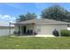 Exterior view featuring patio, a table, chairs, and a BBQ pit at 2413 Sandridge Cir, Eustis, FL 32726