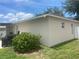 A corner view of an outdoor patio area with a grill at 2413 Sandridge Cir, Eustis, FL 32726