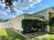 Exterior view of home, featuring mature landscaping and well-maintained lawn at 2413 Sandridge Cir, Eustis, FL 32726