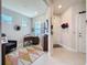 Home office with a sleek desk, a comfy chair, and geometric rug with natural light at 2842 Purple Meadow Ct, Minneola, FL 34715