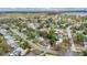 Aerial view of a residential neighborhood showcasing homes with mature trees at 3107 Martinique Way, Orlando, FL 32805