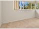 Bright bedroom featuring neutral carpet, and large window at 3107 Martinique Way, Orlando, FL 32805