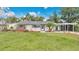 Charming single-story home with a well-maintained lawn and a convenient carport at 3107 Martinique Way, Orlando, FL 32805