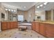 Well-lit bathroom featuring dual vanities, a soaking tub, and elegant tile flooring at 3334 Park Grove Ct, Longwood, FL 32779