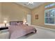 Serene bedroom features plush carpeting, a large window, and neutral walls at 3334 Park Grove Ct, Longwood, FL 32779