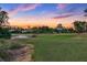 Beautiful golf course and pond on the property at sunset at 3334 Park Grove Ct, Longwood, FL 32779