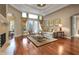 Inviting living area featuring a fireplace, hardwood floors and a serene atmosphere at 3334 Park Grove Ct, Longwood, FL 32779