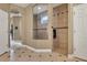 Shower stall featuring tile and a unique window for natural light, located off a wide hallway at 3334 Park Grove Ct, Longwood, FL 32779