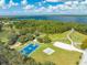 Aerial view featuring community amenities including a basketball court, playground, lake access, and walking trails at 3415 Sagebrush St, Harmony, FL 34773