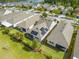 Aerial view of the backyard, featuring a fenced yard and potential solar panels on the roof at 3415 Sagebrush St, Harmony, FL 34773