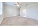 Spacious bedroom with neutral carpet and ceiling fan at 3415 Sagebrush St, Harmony, FL 34773