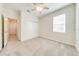 Neutral bedroom with carpet flooring, a ceiling fan, and a closet at 3415 Sagebrush St, Harmony, FL 34773