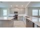 Modern kitchen featuring stainless steel appliances and a center island at 3415 Sagebrush St, Harmony, FL 34773