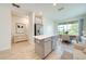 Bright kitchen with a kitchen island, stainless steel appliances, and a dining area at 3415 Sagebrush St, Harmony, FL 34773