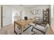 Bright home office with modern furnishings and a view into the kitchen at 3415 Sagebrush St, Harmony, FL 34773