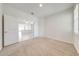 Bright room with neutral carpet, doors, and views of the eat-in kitchen at 3415 Sagebrush St, Harmony, FL 34773