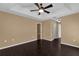 Bedroom features hardwood floors and multiple doorways at 346 Vista Oaks Way, Davenport, FL 33837