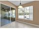 Bright dining area with large windows and sliding glass door at 346 Vista Oaks Way, Davenport, FL 33837