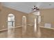 Expansive living room with vaulted ceilings and open layout, showcasing tile flooring at 346 Vista Oaks Way, Davenport, FL 33837